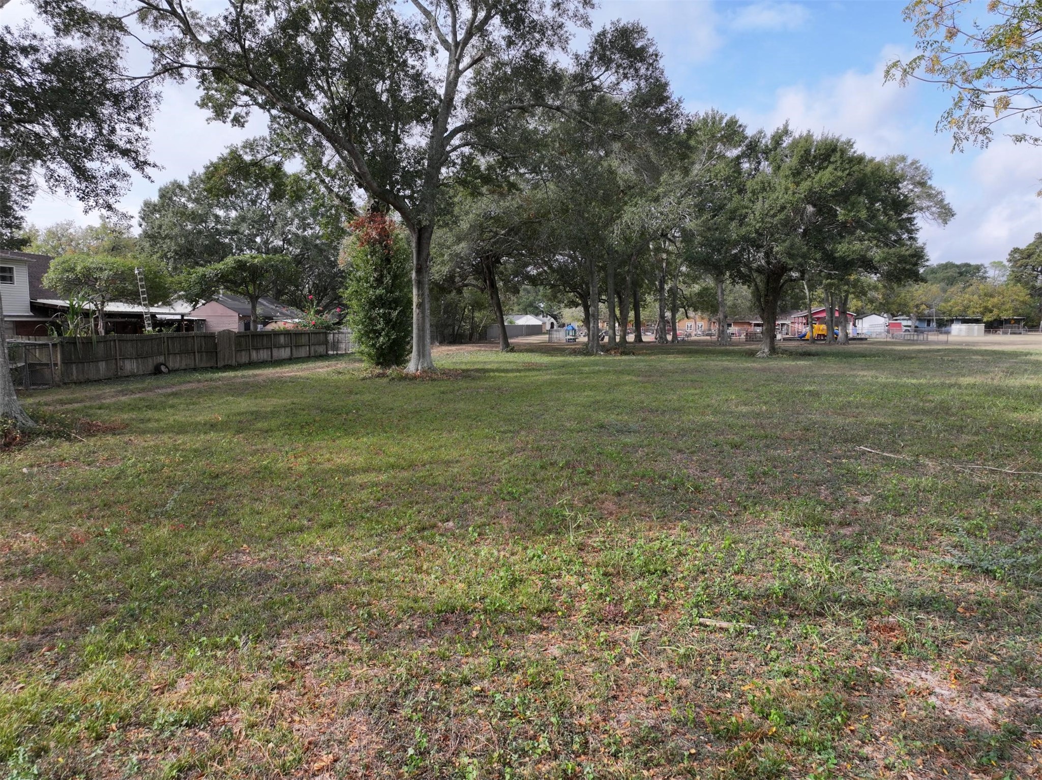 2417 4th Street Rosenberg, TX 77471 - Photo 34 of 50 a view of a field with trees