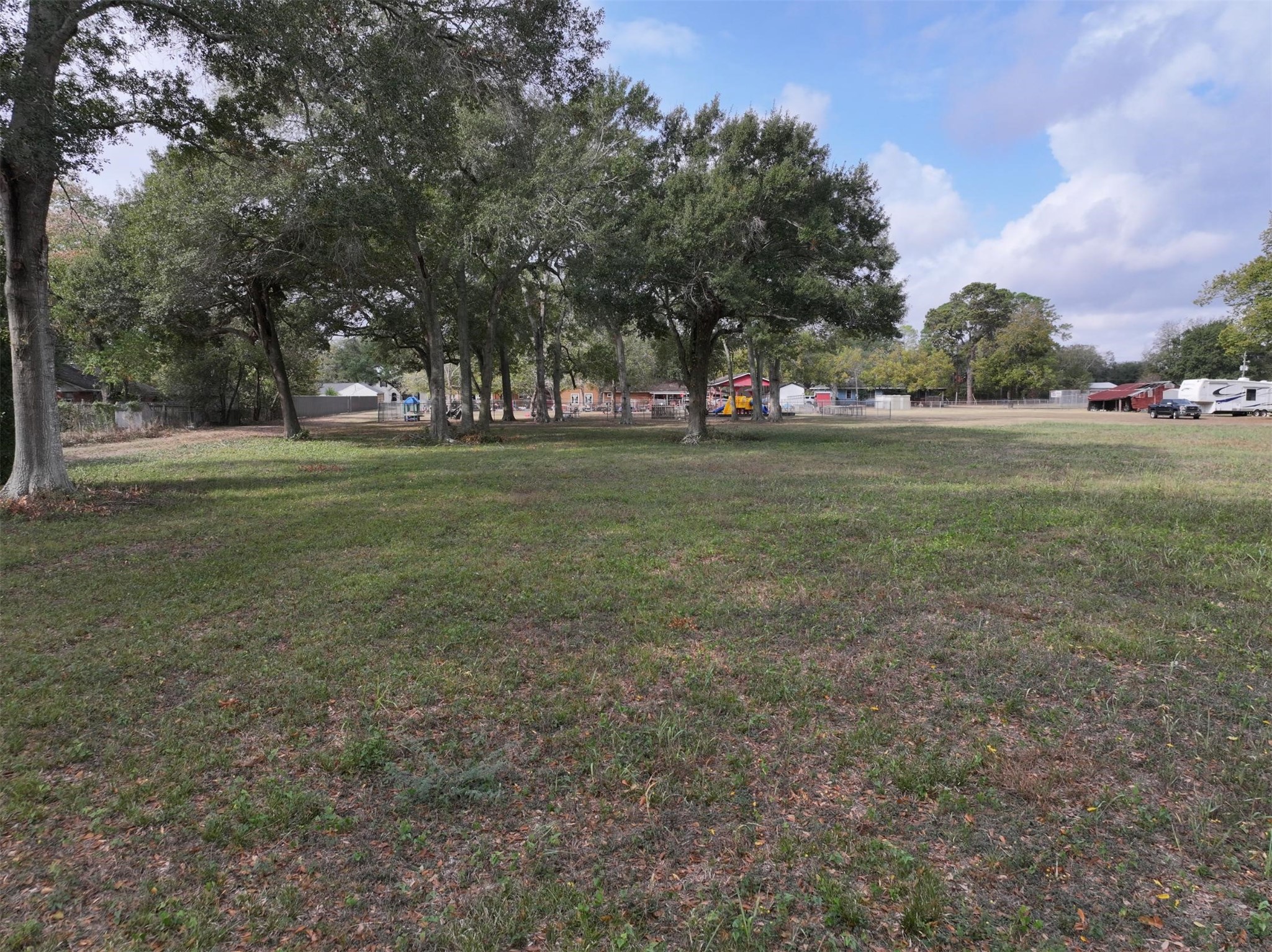 2417 4th Street Rosenberg, TX 77471 - Photo 35 of 50 a view of field with trees in the background