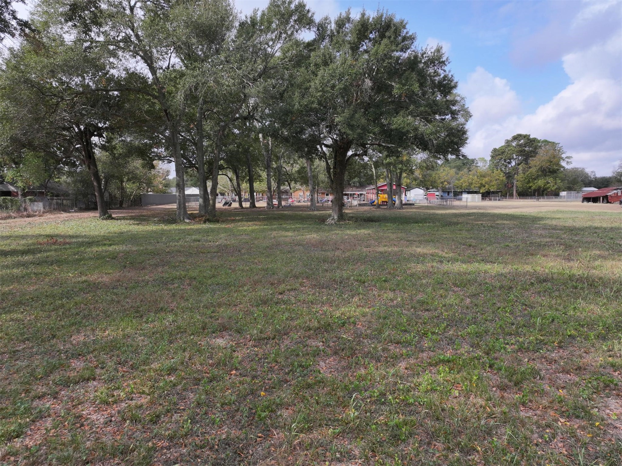2417 4th Street Rosenberg, TX 77471 - Photo 36 of 50 a view of a field with trees