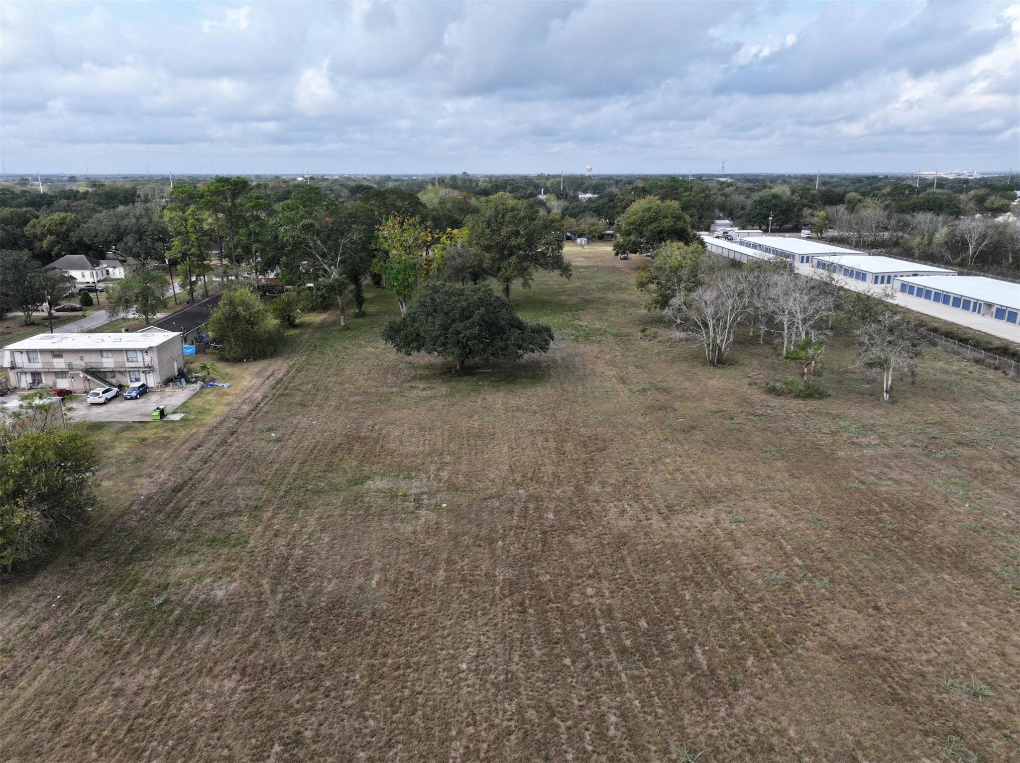 2417 4th Street Rosenberg, TX 77471 - Photo 9 of 50 a view of a dry yard with wooden fence
