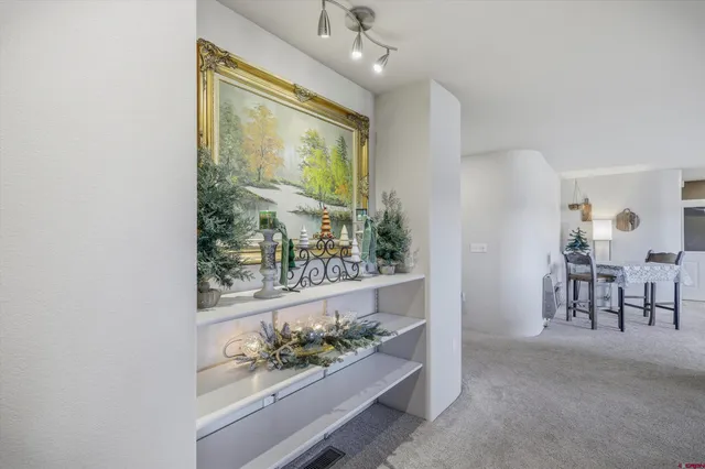 a view of a balcony with furniture and wooden floor
