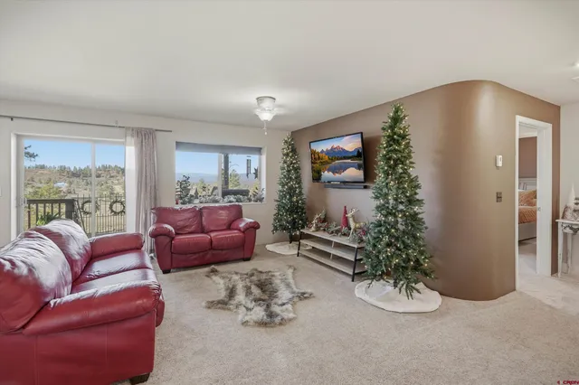 a kitchen with granite countertop a sink window and cabinets