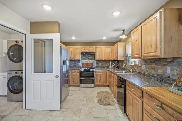 a living room with furniture a large window and a flat screen tv