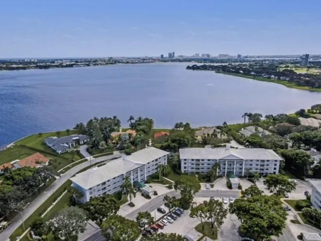 an aerial view of a house with garden space and outdoor seating
