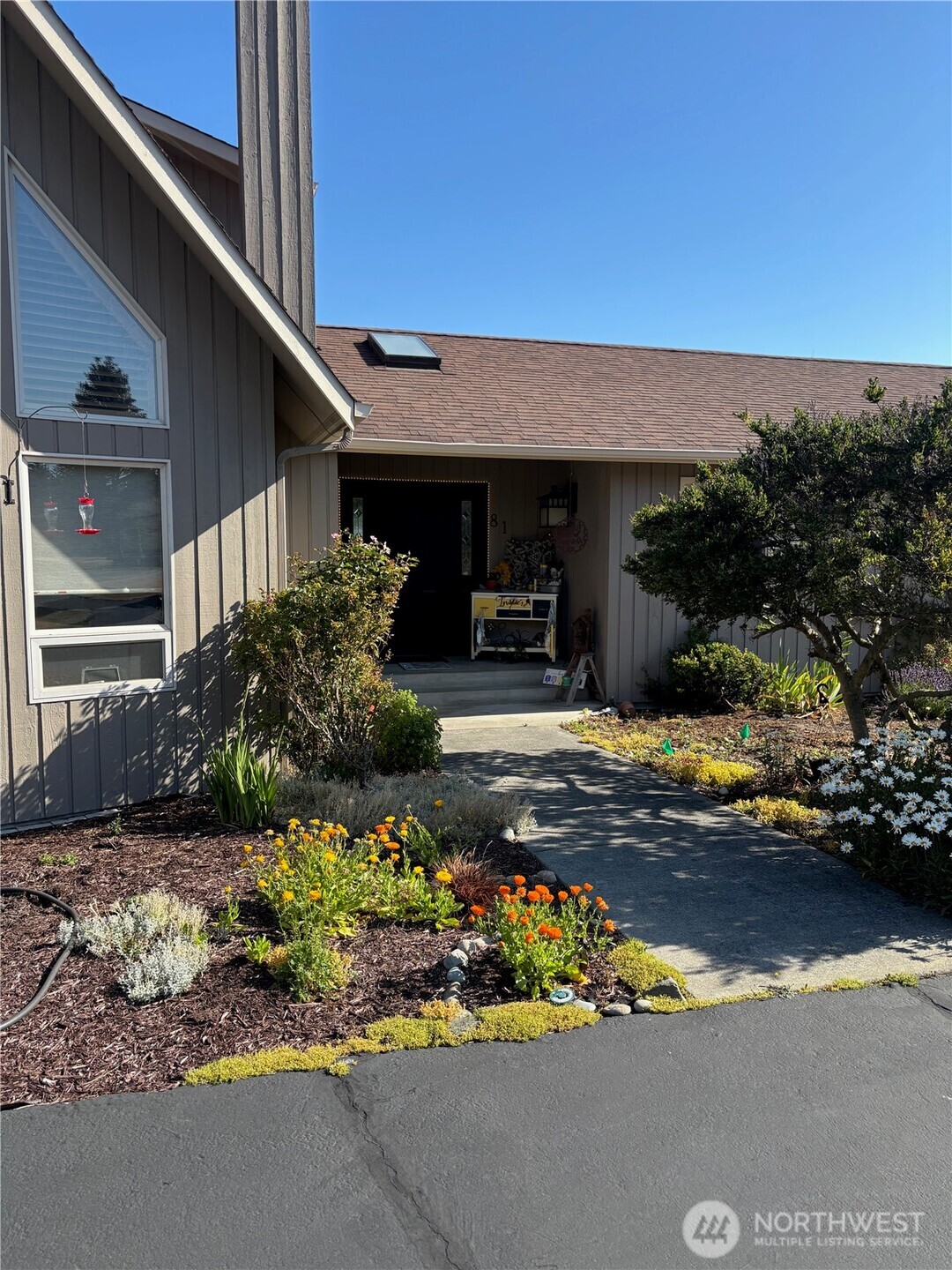 81 Bon Jon View Way Sequim, WA 98382 - Photo 3 of 38 a front view of a house with a yard