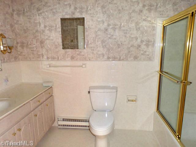 3161 Alamance Church Road Julian, NC 27283 - Photo 9 of 16 Bath. Main Floor guest bath has tub/shower.