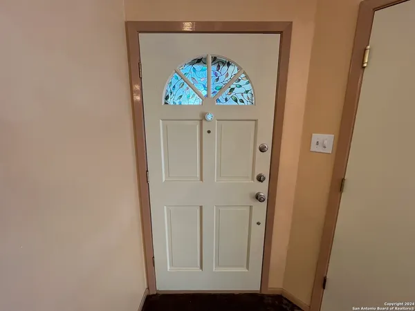 view of entryway with wooden floor