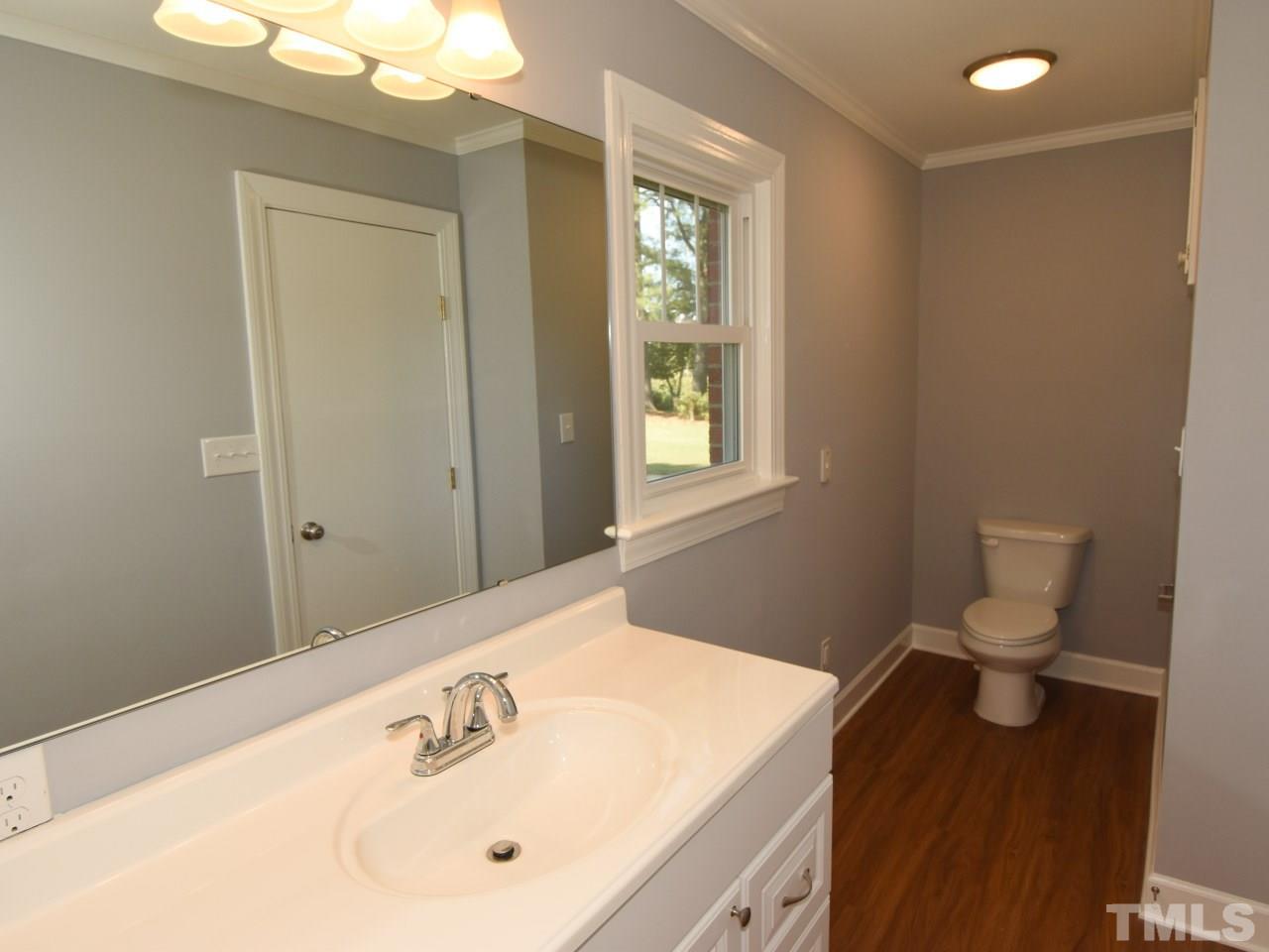 1525 Micro Road Selma, NC 27576 - Photo 13 of 25 New vanities, new bathtub/shower, fresh paint,new flooring