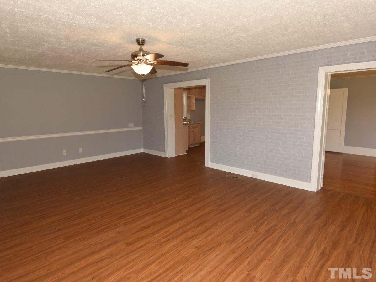 1525 Micro Road Selma, NC 27576 - Photo 14 of 25 Family room opens to roomy kitchen, formal livingroom, new easy care flooring, fresh paint