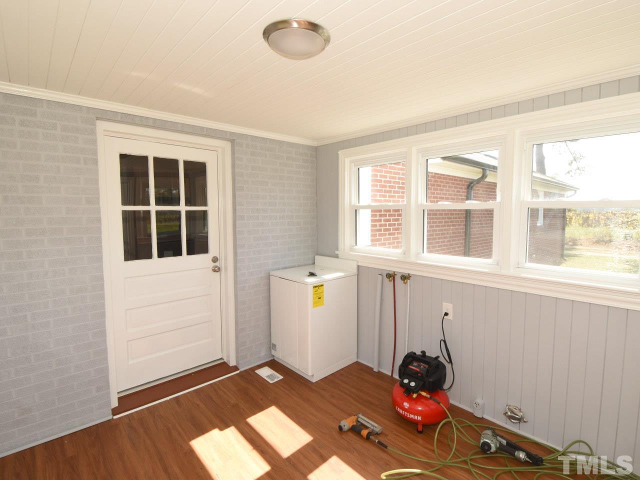 1525 Micro Road Selma, NC 27576 - Photo 17 of 25 Huge laundryroom/backporch with new flooring, new light fixtures, freshly painted