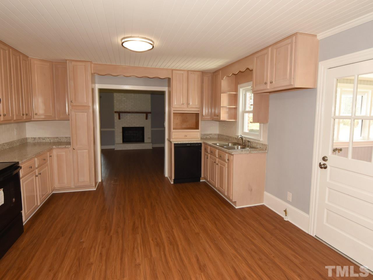 Large kitchen with new appliances, new easy care flooring.