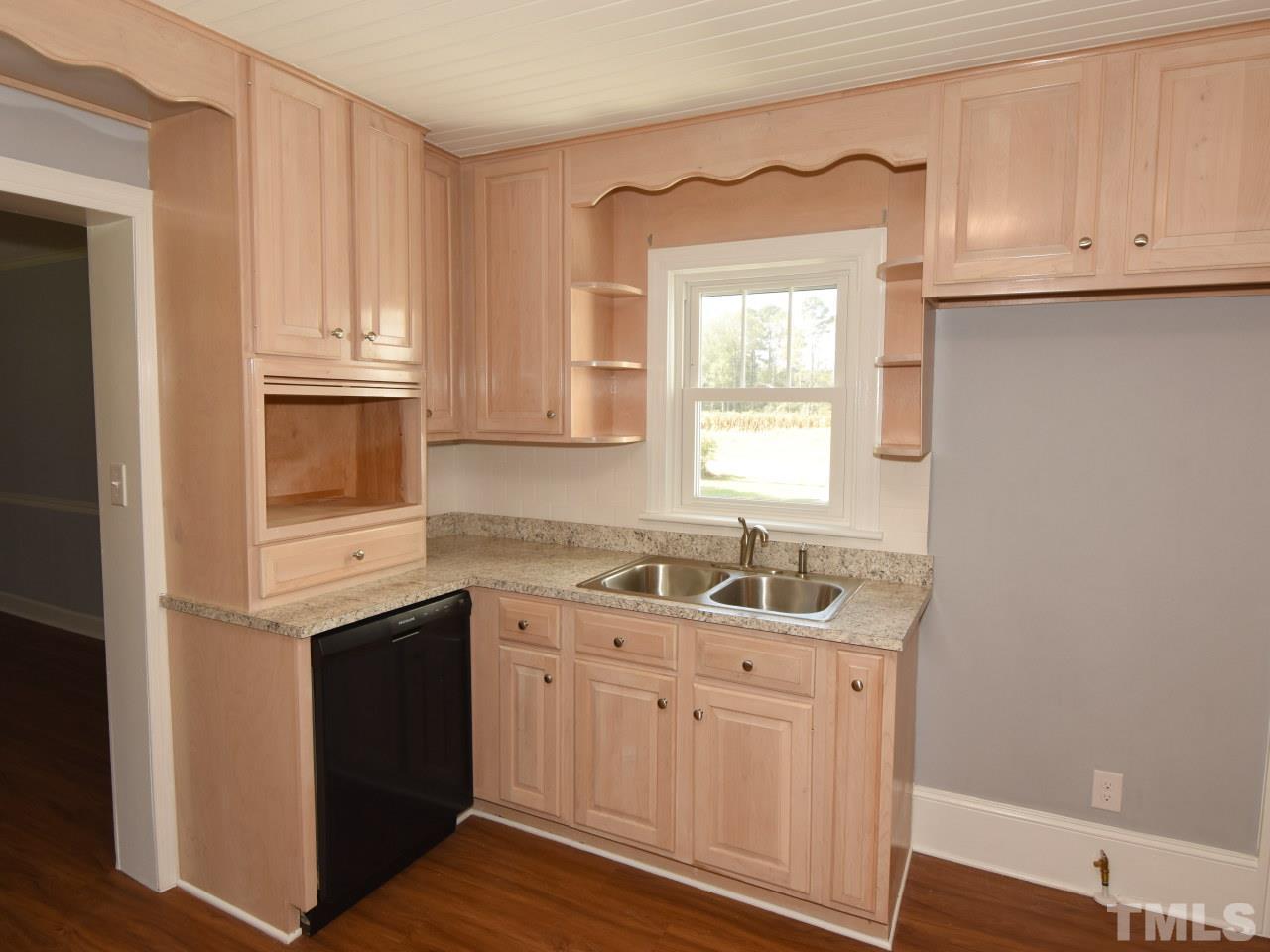 1525 Micro Road Selma, NC 27576 - Photo 8 of 25 Lots of counterspace and cabinets in roomy kitchen.