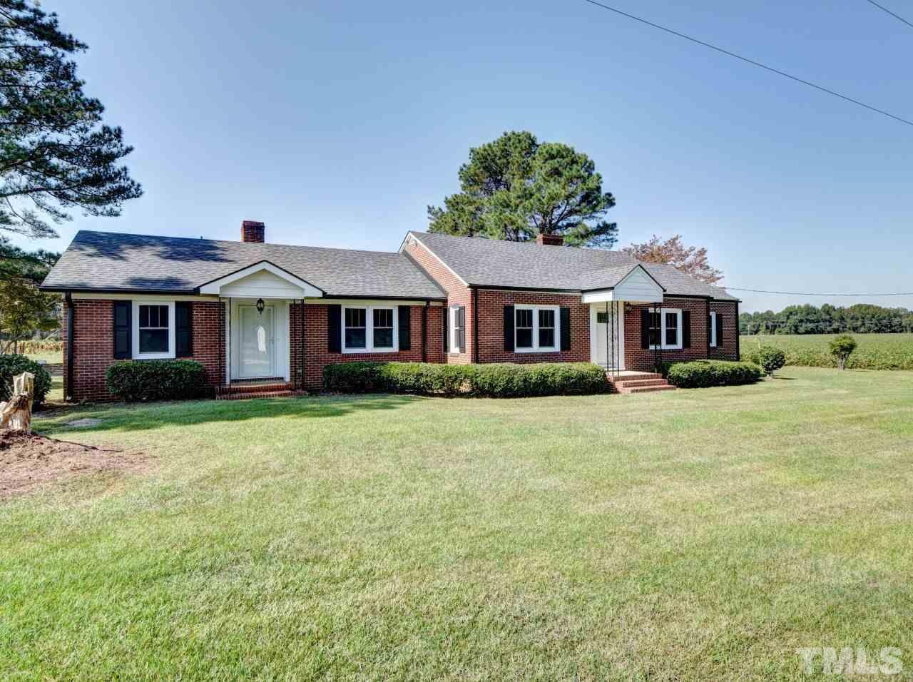 1525 Micro Road Selma, NC 27576 - Photo 9 of 25 Beautiful brick exterior with vinyl and aluminum on other areas.