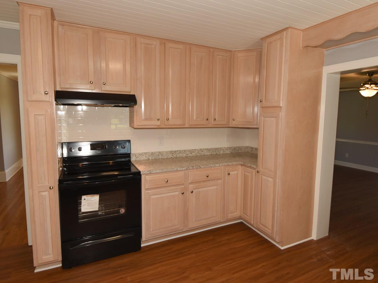 1525 Micro Road Selma, NC 27576 - Photo 10 of 25 New stove, vent hood, new countertops, beadboard ceiling