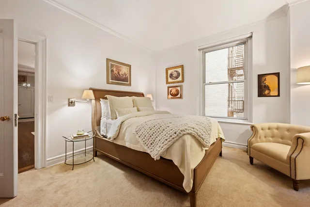 a kitchen with a sink a stove a refrigerator and cabinets
