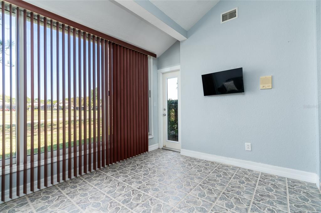 1985 Rutgers Place, Unit 1985 Port Orange, FL 32128 - Photo 11 of 56 a view of a livingroom with a flat screen tv