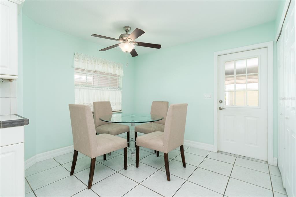 1985 Rutgers Place, Unit 1985 Port Orange, FL 32128 - Photo 15 of 56 a dining room with furniture and window