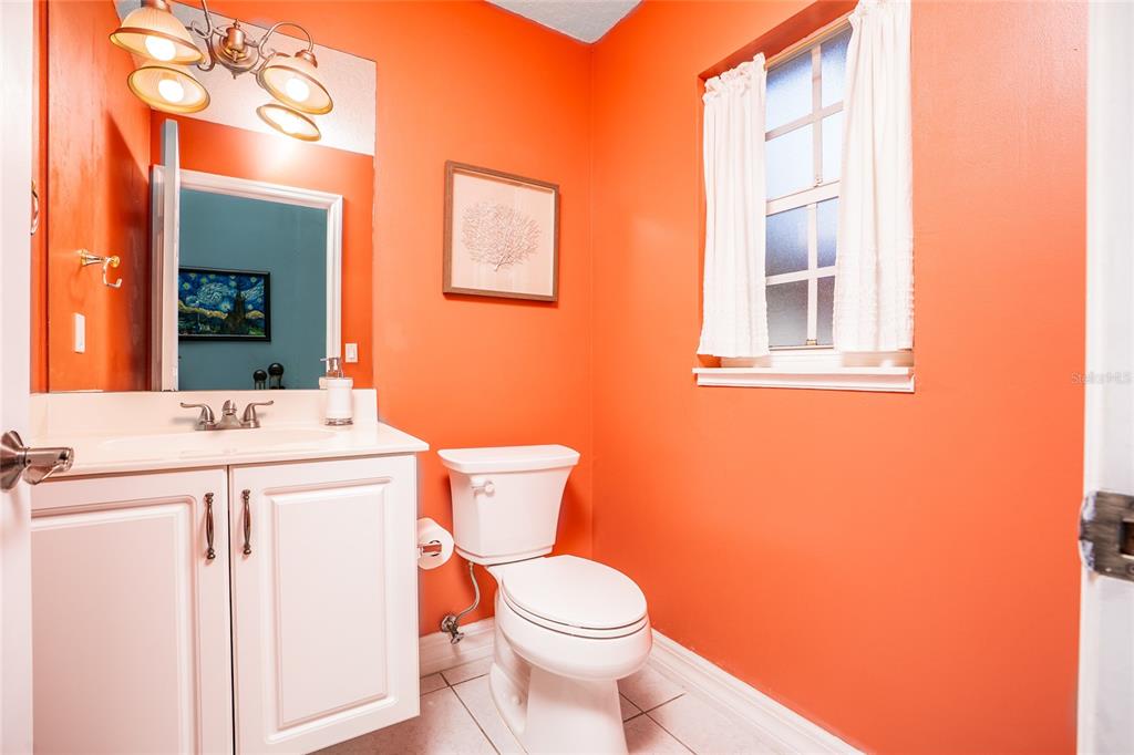 1985 Rutgers Place, Unit 1985 Port Orange, FL 32128 - Photo 16 of 56 a bathroom with a toilet sink and mirror