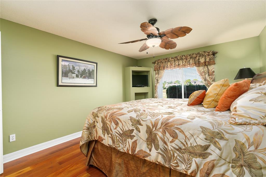 1985 Rutgers Place, Unit 1985 Port Orange, FL 32128 - Photo 18 of 56 a bed in a bedroom next to a window