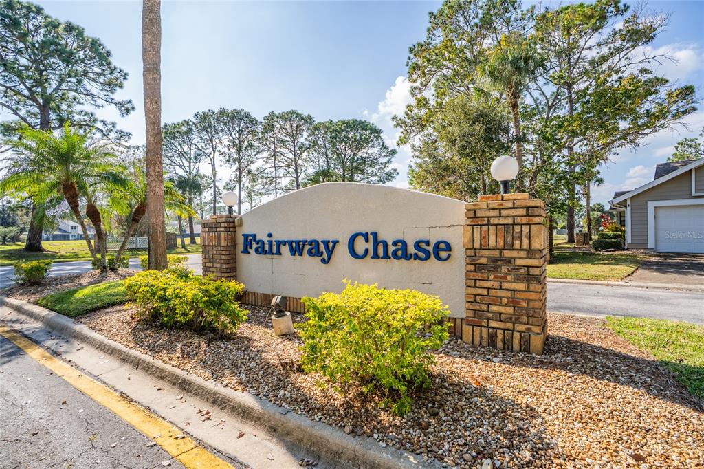 1985 Rutgers Place, Unit 1985 Port Orange, FL 32128 - Photo 2 of 56 a view of a house with a yard and potted plants