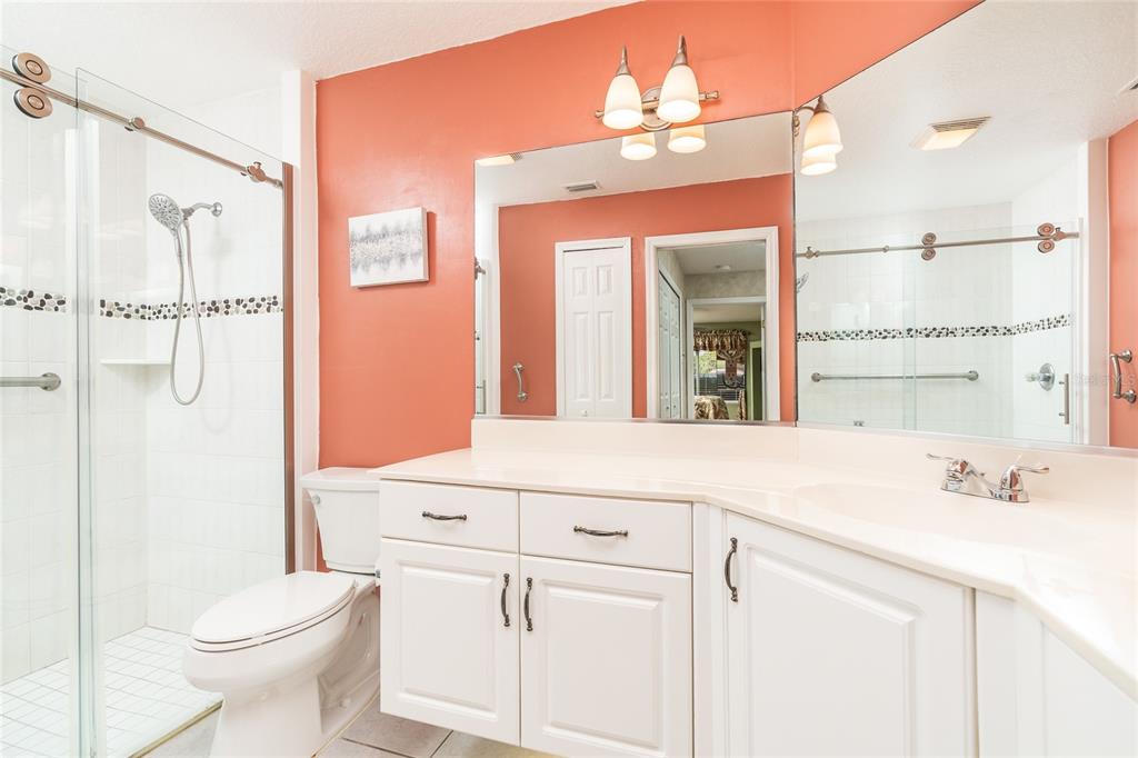 1985 Rutgers Place, Unit 1985 Port Orange, FL 32128 - Photo 21 of 56 a bathroom with a sink a toilet and shower
