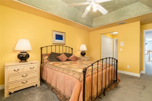 a bedroom with a bed and a dresser