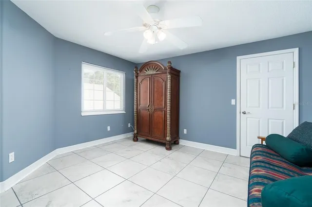 a view of livingroom with workspace and a window