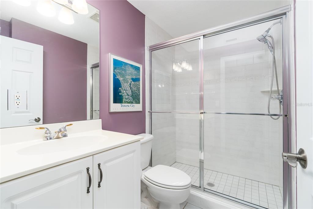 1985 Rutgers Place, Unit 1985 Port Orange, FL 32128 - Photo 29 of 56 a bathroom with a sink toilet vanity and shower