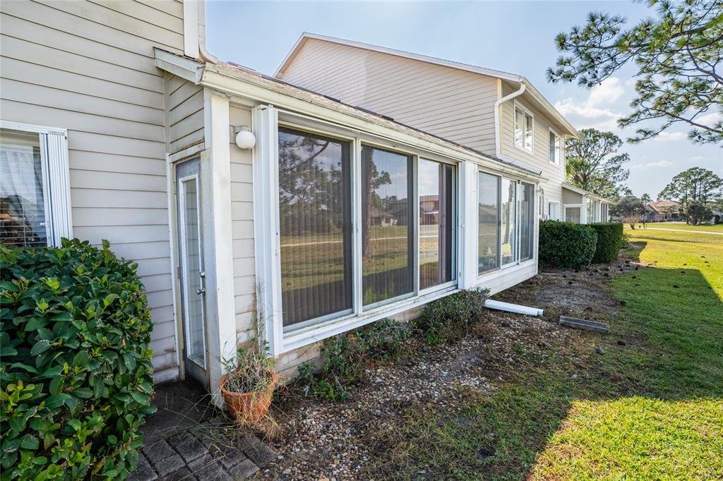 1985 Rutgers Place, Unit 1985 Port Orange, FL 32128 - Photo 30 of 56 a view of a house with backyard and garden