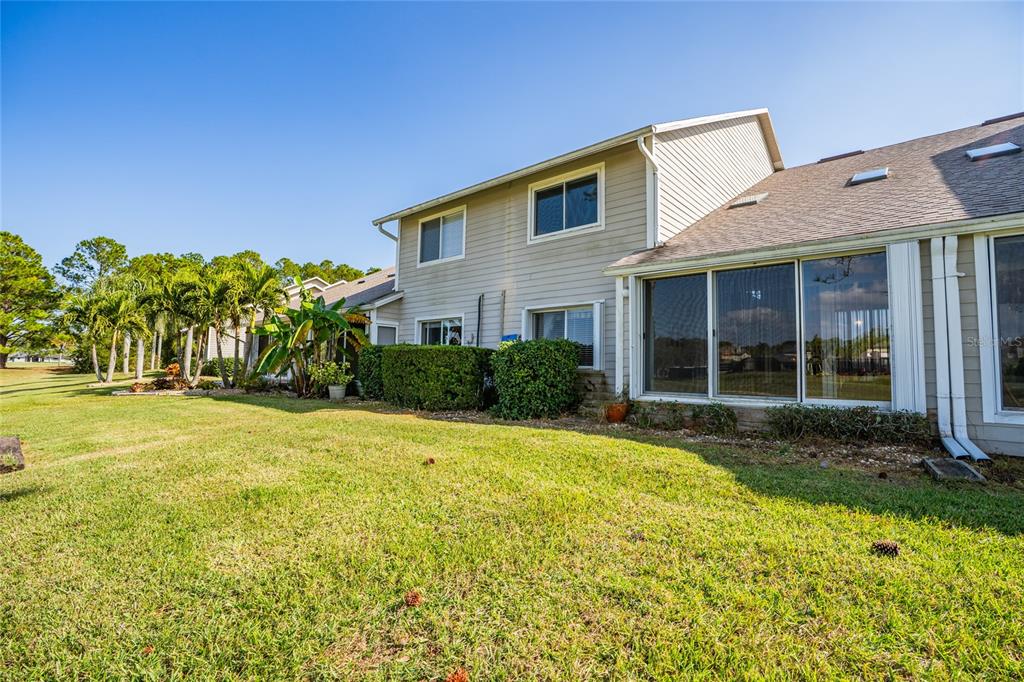 1985 Rutgers Place, Unit 1985 Port Orange, FL 32128 - Photo 31 of 56 a view of a house with backyard and garden
