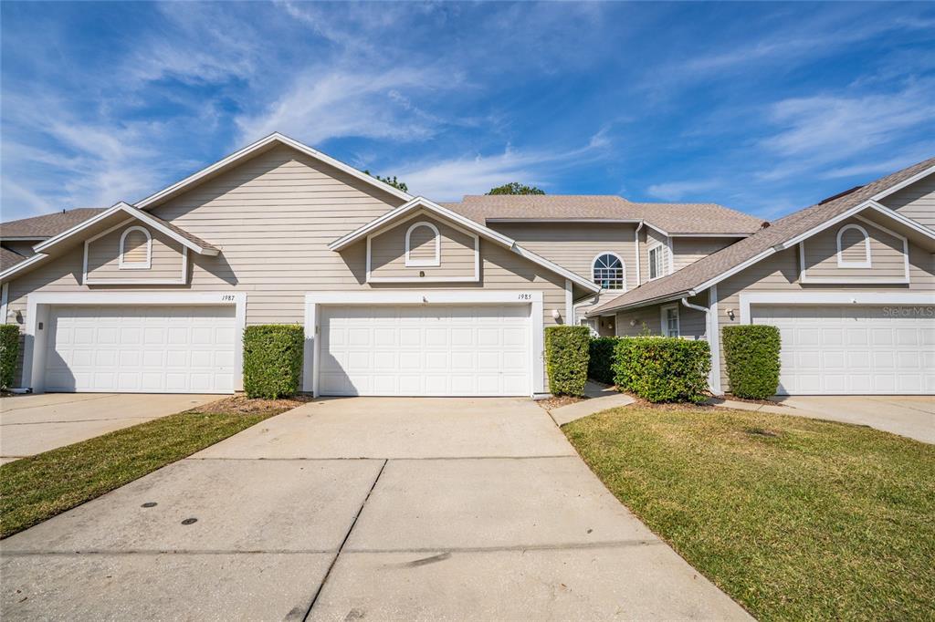 1985 Rutgers Place, Unit 1985 Port Orange, FL 32128 - Photo 35 of 56 a view of a house with a yard