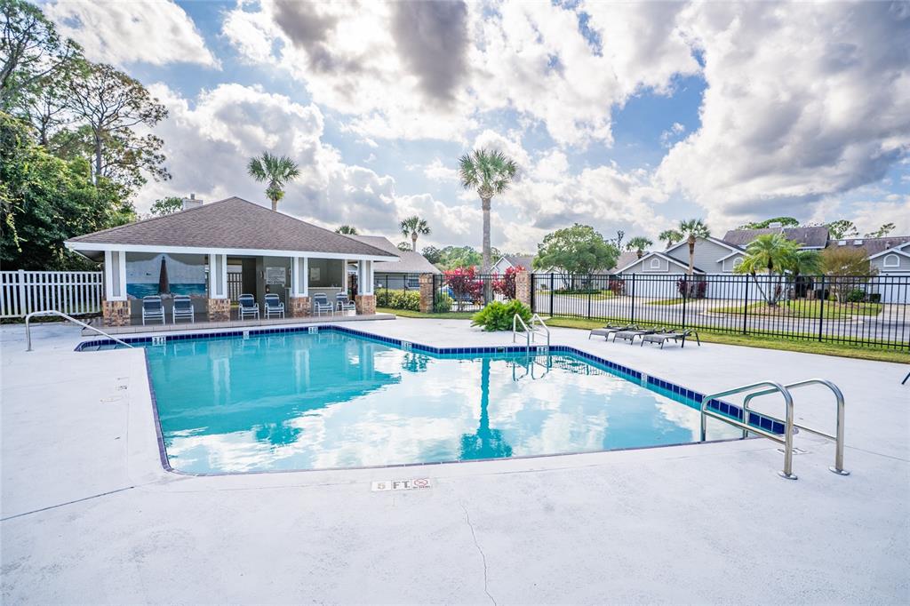 1985 Rutgers Place, Unit 1985 Port Orange, FL 32128 - Photo 36 of 56 a view of a swimming pool with a deck