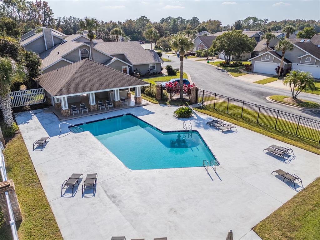 1985 Rutgers Place, Unit 1985 Port Orange, FL 32128 - Photo 37 of 56 an aerial view of a house with swimming pool