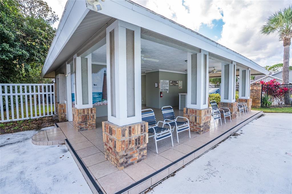 1985 Rutgers Place, Unit 1985 Port Orange, FL 32128 - Photo 38 of 56 a view of a patio with couches table and chairs and potted plants