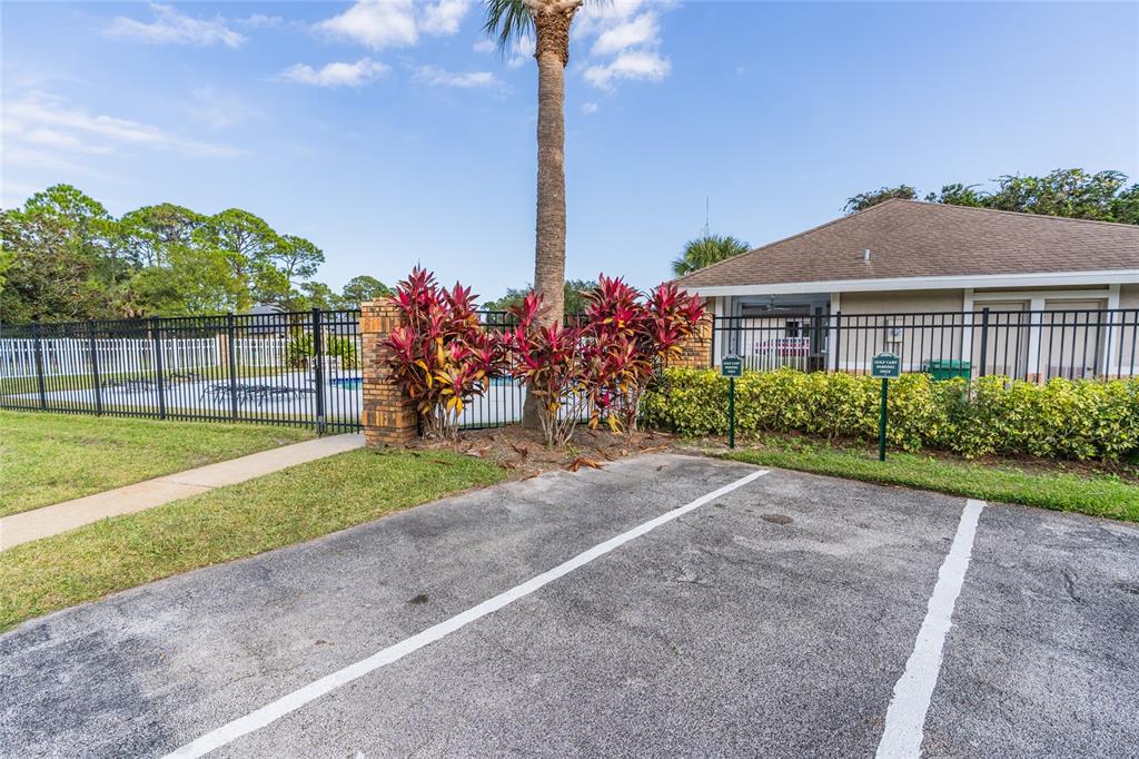 1985 Rutgers Place, Unit 1985 Port Orange, FL 32128 - Photo 41 of 56 a view of a house with a yard and a fountain