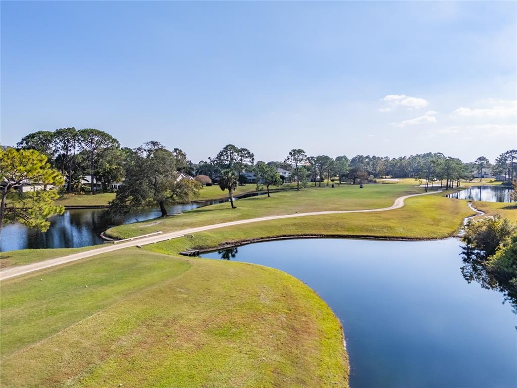 1985 Rutgers Place, Unit 1985 Port Orange, FL 32128 - Photo 48 of 56 a view of a swimming pool and an outdoor seating