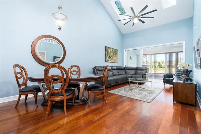 a living room with furniture a rug and a window