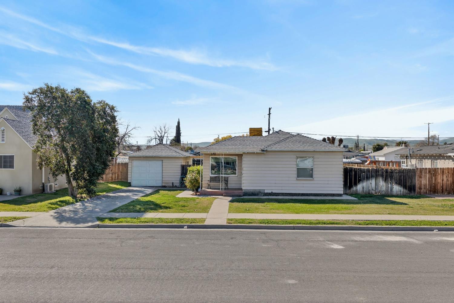 248 Harrison Street Coalinga, CA 93210 - Photo 16 of 30 a view of a house with a big yard and large trees