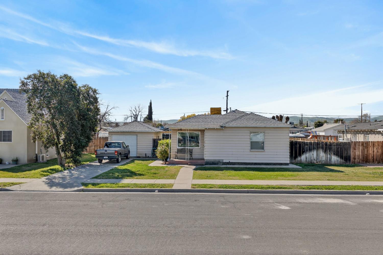 248 Harrison Street Coalinga, CA 93210 - Photo 17 of 30 a view of a house with a big yard and large trees