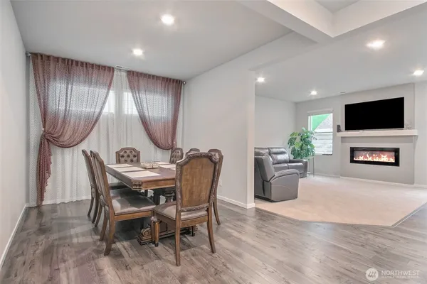a view of a livingroom with furniture and a flat screen tv