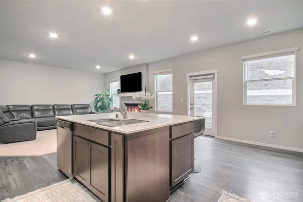a kitchen with a stove and a sink