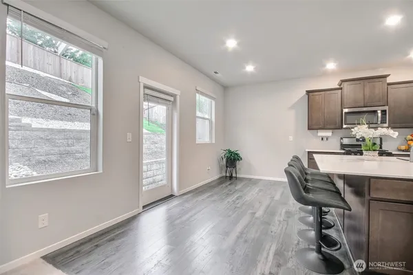 a workspace with furniture window and wooden floor