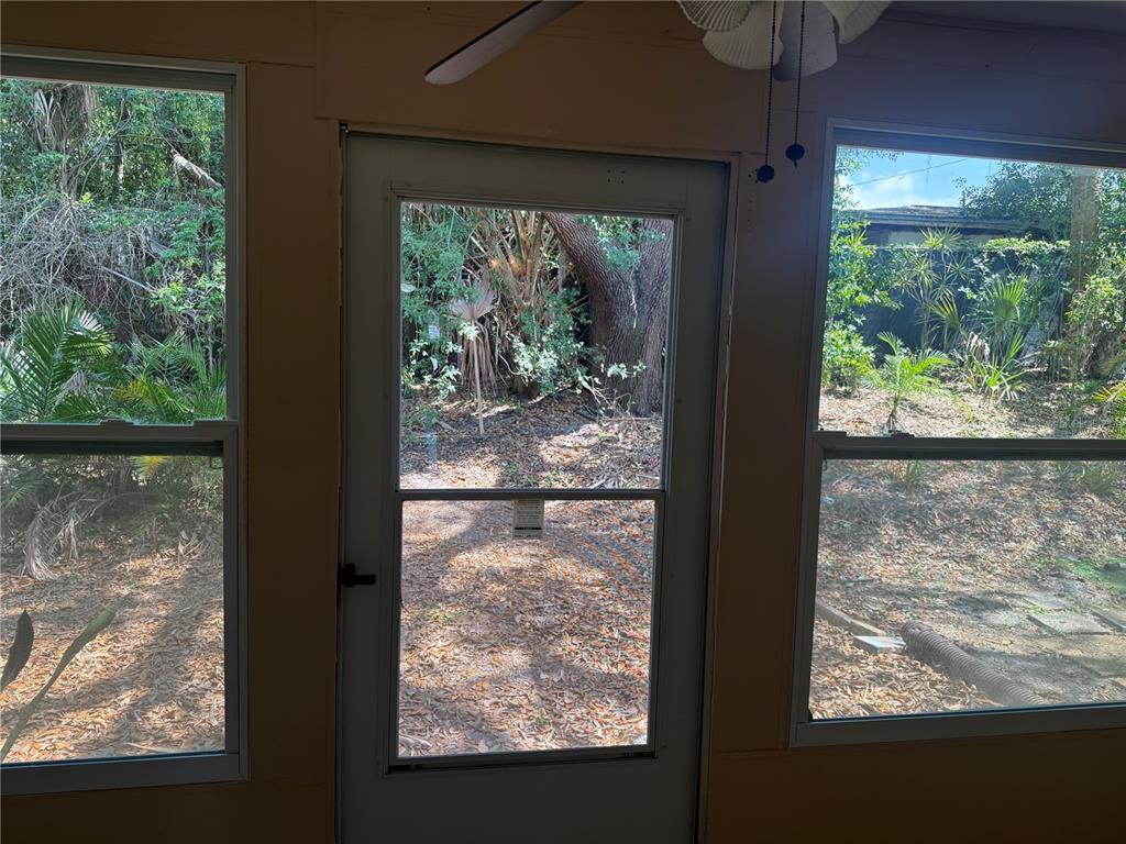 4244 Sheldon Place, Unit 4244 New Port Richey, FL 34652 - Photo 15 of 23 a view of a room with a large window wooden floor and outside view