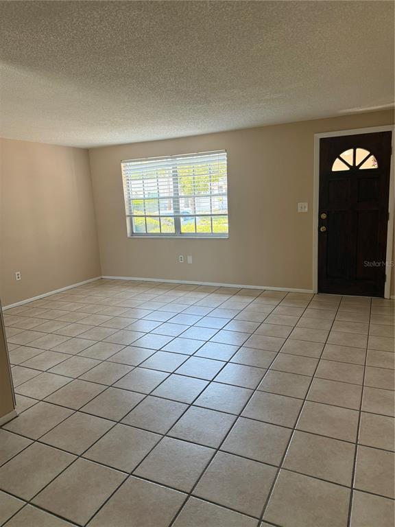 4244 Sheldon Place, Unit 4244 New Port Richey, FL 34652 - Photo 3 of 23 a view of an empty room and window