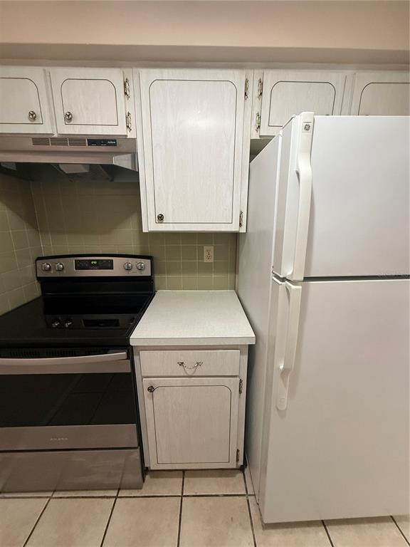 4244 Sheldon Place, Unit 4244 New Port Richey, FL 34652 - Photo 4 of 23 a utility room with dryer and washer