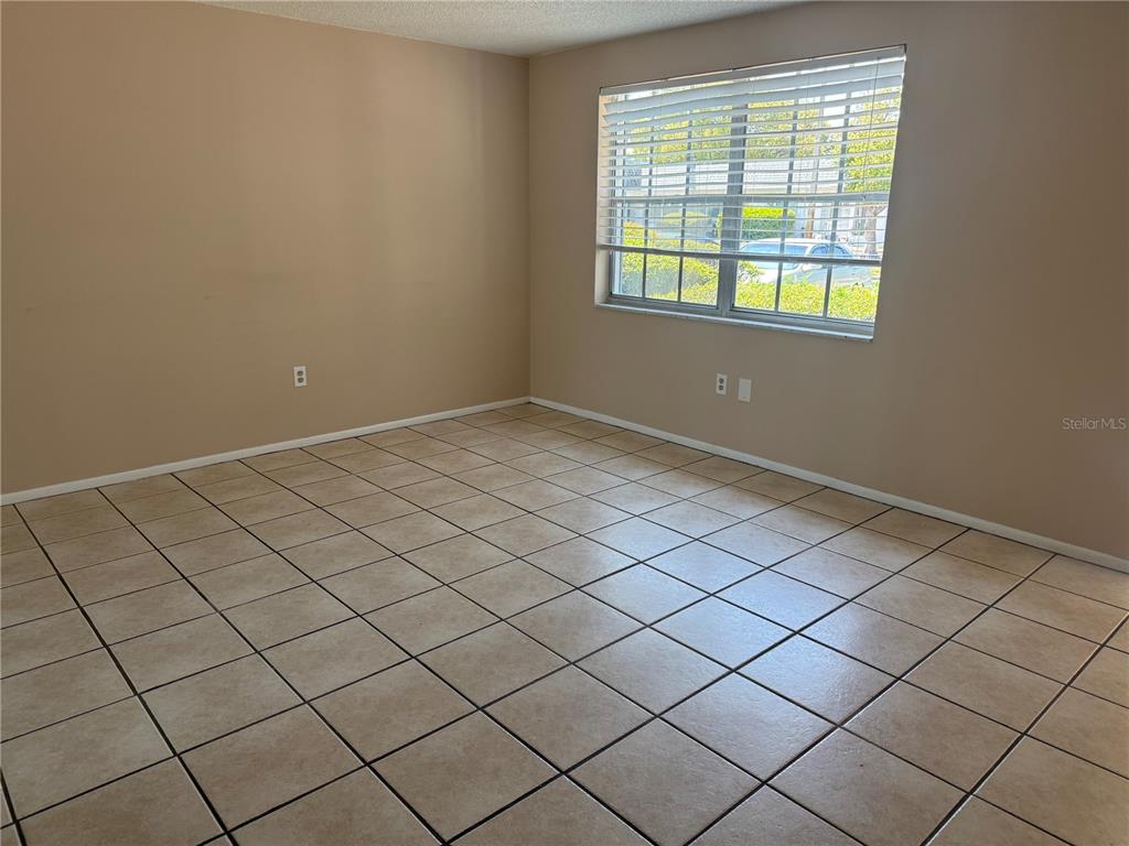 4244 Sheldon Place, Unit 4244 New Port Richey, FL 34652 - Photo 8 of 23 a view of an empty room and window
