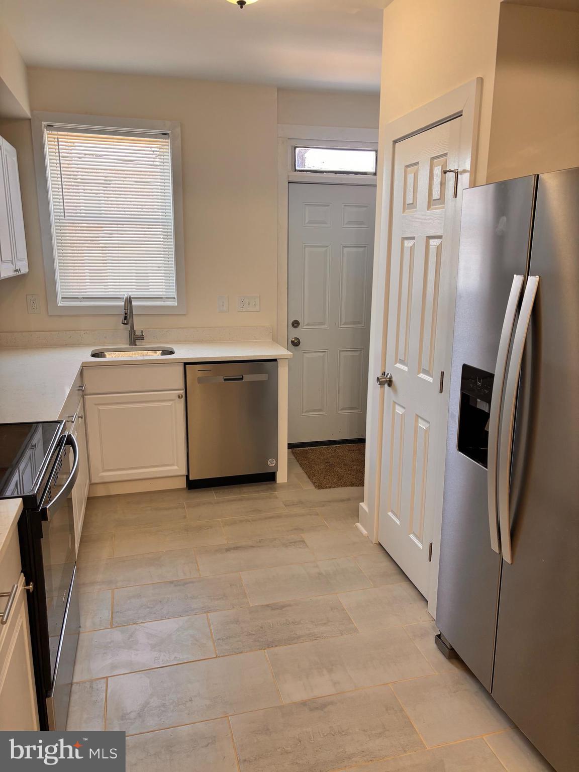 1220 North Potomac Street Baltimore, MD 21213 - Photo 6 of 34 Nice new SS appliances w/ freshly painted walls