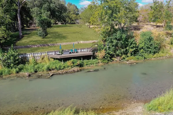 a view of a lake with a building in the background