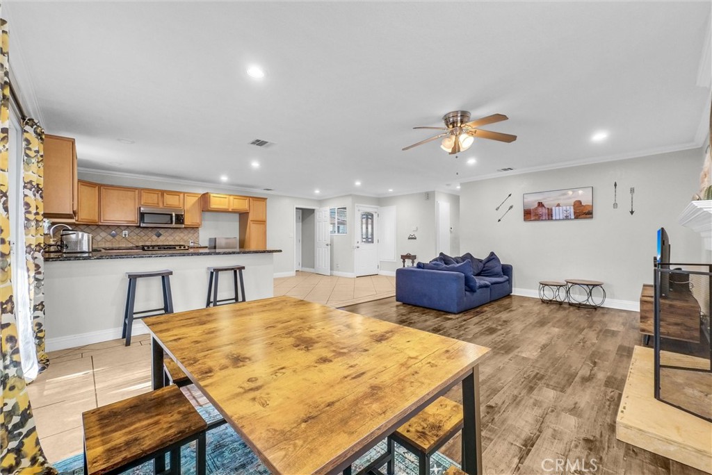 6220 Filkins Avenue Rancho Cucamonga, CA 91737 - Photo 13 of 37 a kitchen with a table and chairs in it