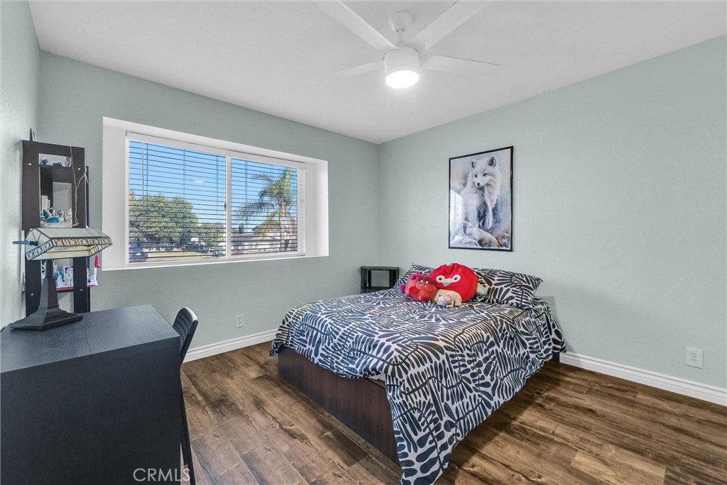 6220 Filkins Avenue Rancho Cucamonga, CA 91737 - Photo 22 of 37 a bedroom with a bed and wooden floor